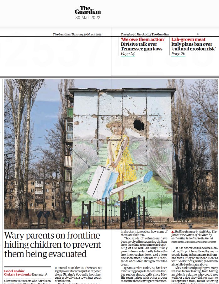 Newspaper article from The Guardian dated March 30, 2023. At the top of the image is the newspaper headline. Below is a large photo of a wall with a damaged painting of a girl watering flowers. Trees and residential buildings are visible to the left and right of the wall. The article's headline is: 'Parents on the front line hide children to prevent their evacuation.' The article describes the situation in Bahmut and other areas along the front line in Ukraine, where volunteers are helping civilians, including children.